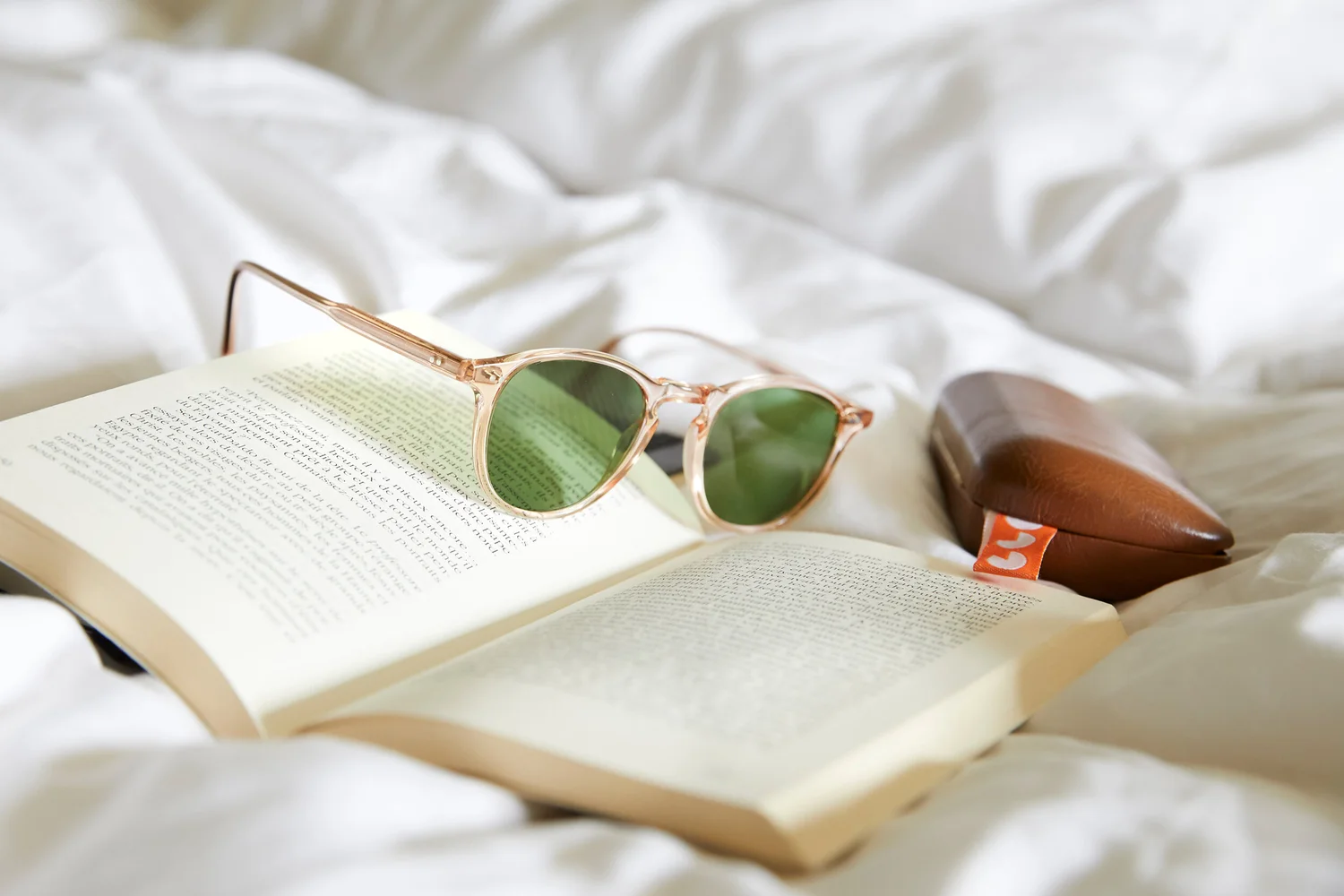 Garrett Leight sunglasses on a book