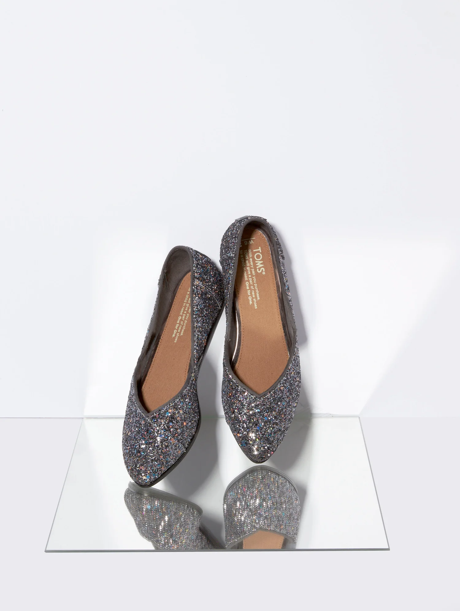 TOMS glitter flats on mirror