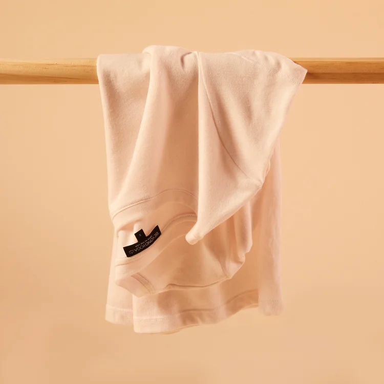 Beyond Yoga top on wooden dowel