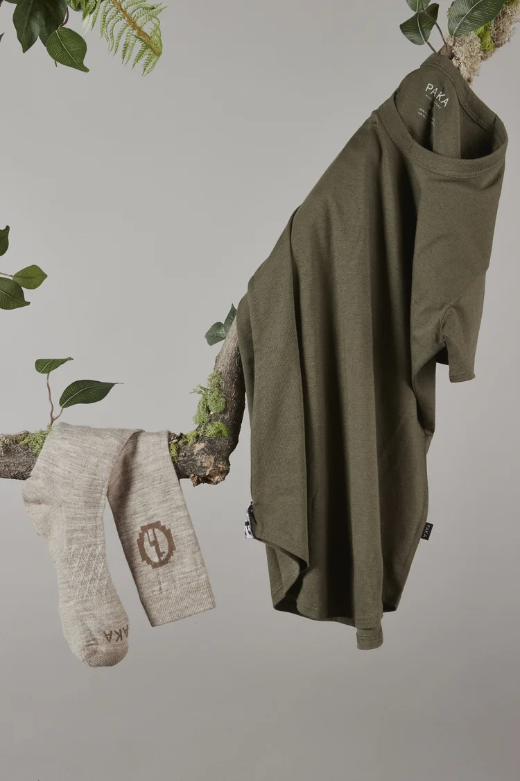 PAKA tee and socks on a branch