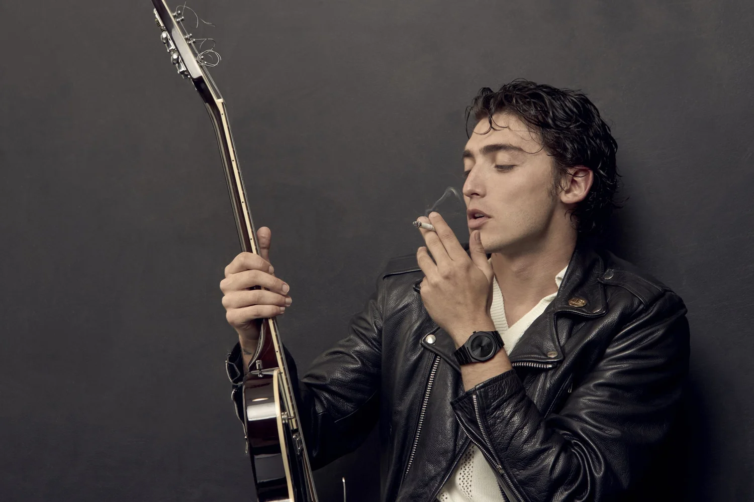 Louis Cartel — leather jacket and guitar