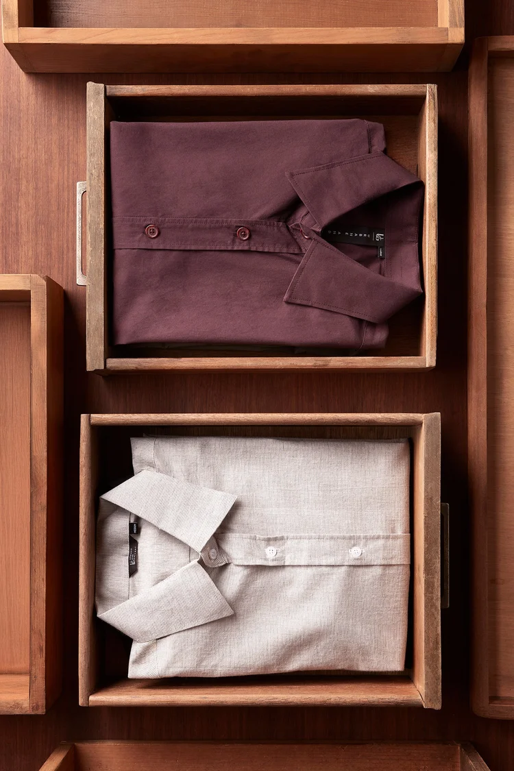 Folded shirts in wooden trays