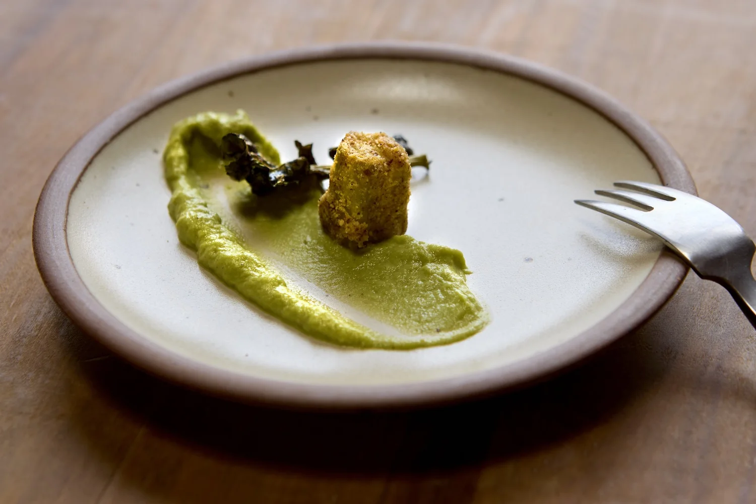 Plated croquette with green sauce