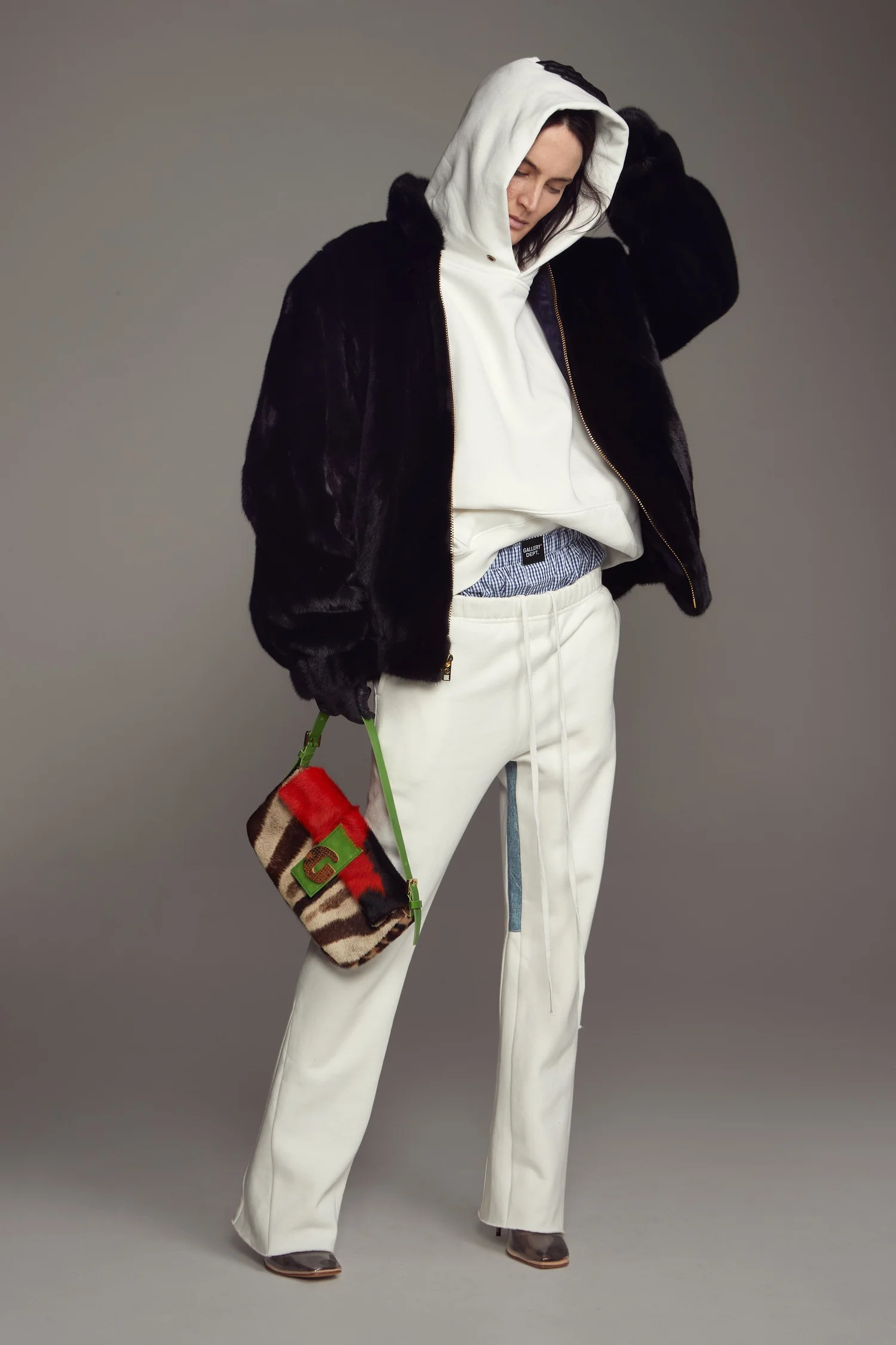 Model in black fur jacket and white sweats, Gallery Dept.