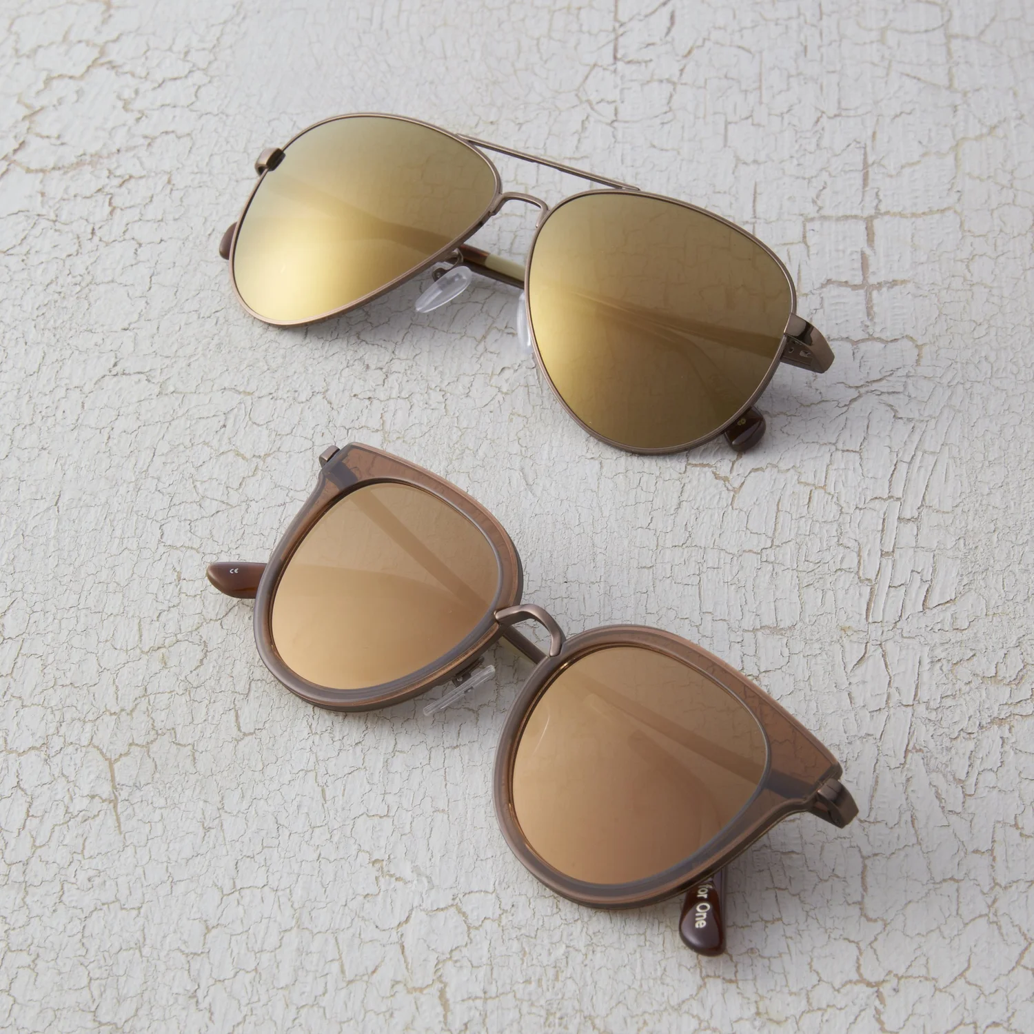 Mirrored sunglasses on crackle texture